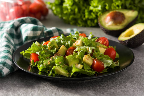 istock Salad with avocado, lettuce, tomato and flax seeds 1209055498