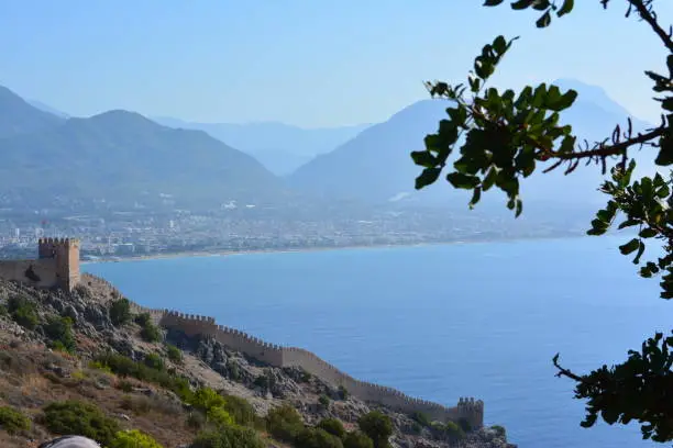 Red tower of Alanya in turkey (Kizil Kule) with old castle wall