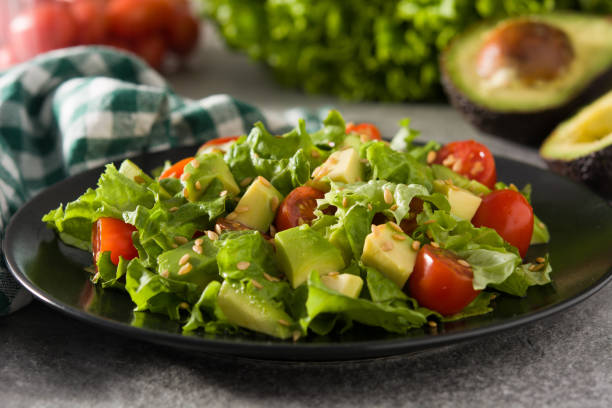 istock Salad with avocado, lettuce, tomato and flax seeds 1209056271