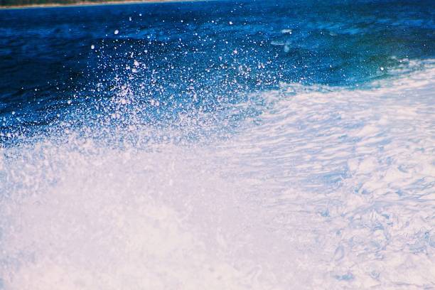 Crashing white waves at the beach.