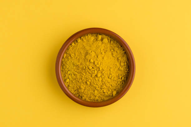 istock Heap of curcuma detail 1209056795