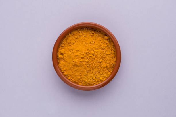 istock Heap of curcuma detail 1209056797