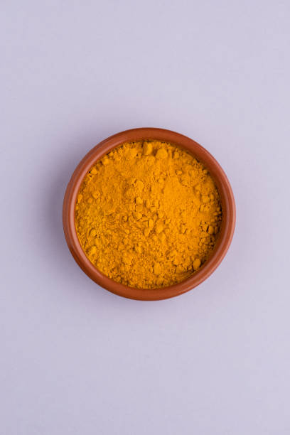 istock Heap of curcuma detail 1209056800