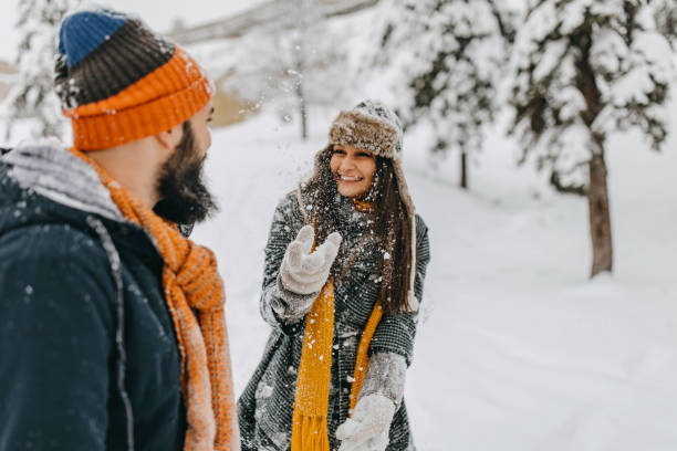 istock Couple in the snow playing 1209057183