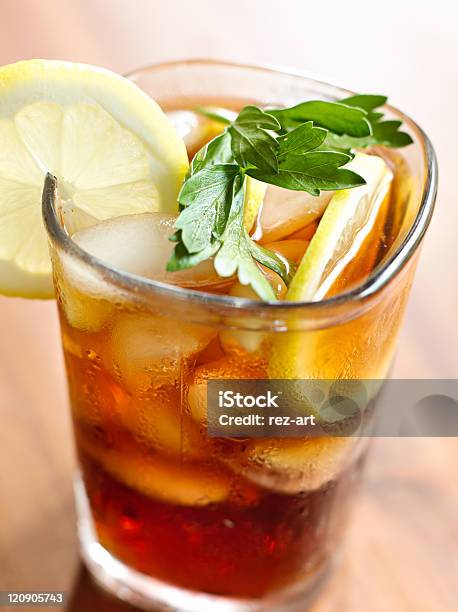 Iced Tea With Lemon Slice And Leaf Garnish Stock Photo - Download Image Now - Cold Temperature, Color Image, Condensation