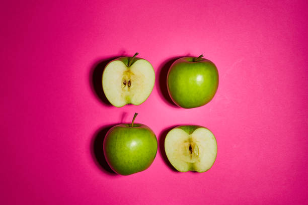 istock Green apple on pink background. Flat lay, top view, copy space . Food dietary concept. 1209058065