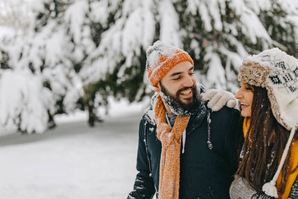 istock Couple in the snow playing 1209058098