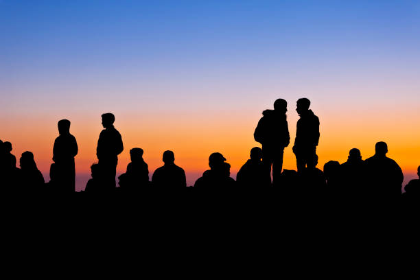 Concept of crowd people silhouette.\nPhotoshop was made so that the faces did not recognize.\nThe silhouette is extra dark.