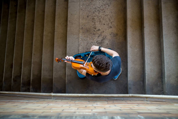 istock Street musician playing violin 1209059802