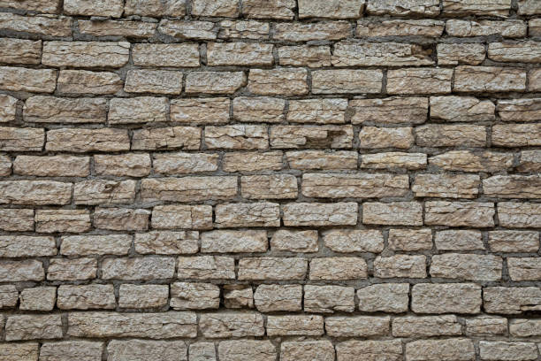 istock The brown and grey  cobblestone or brick tower, fortress or castle wall background or texture 1209060088