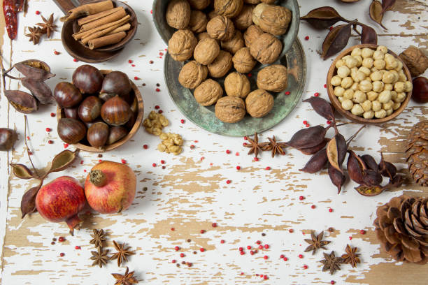 istock Different types of nuts: walnut, hazelnut, cashew, peanuts, pine, chestnuts, almonds, pomegranates, cinnamon, peanuts and other 1209063120