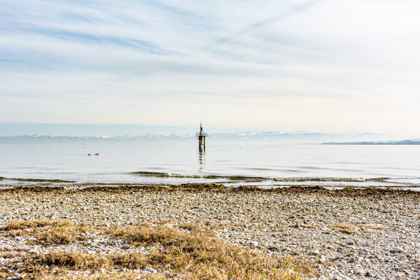 Lake Constance in winter sunlight with beach stock photo