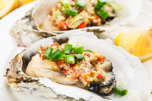 istock Barbecue overbaked fresh opened oyster with garlic, 1209066451