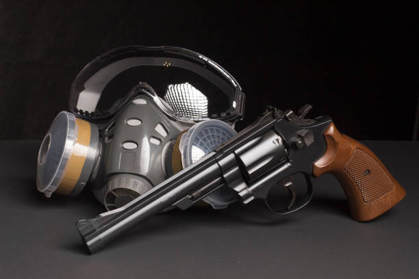 istock Gas mask and gun 1209071585