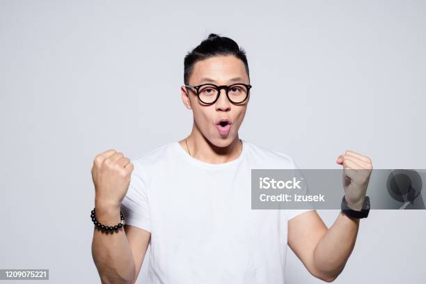 Excited Asian Winner Stock Photo - Download Image Now - Asian and Indian Ethnicities, Men, Excitement
