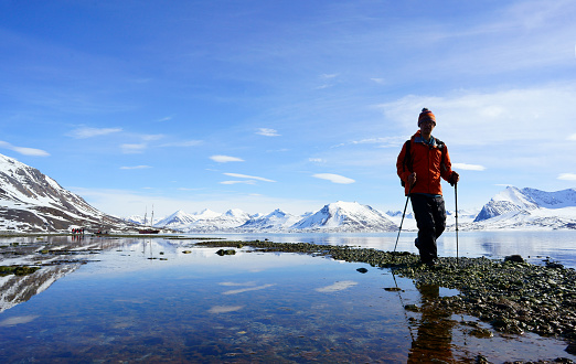 Man hiking in Spitsbergen Mountain scene of the Spitsbergen Mountains in Isfjord
