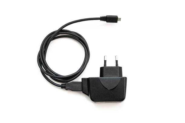 ブラック電源アダプタ - mobile phone charging power plug adapter ストックフォトと画像