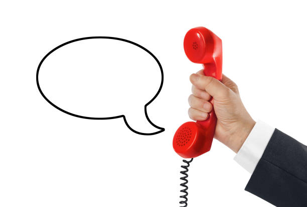 Telephone receiver in hand and speech bubble isolated on white background