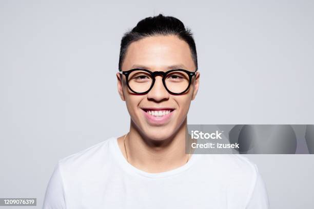 Friendly Asian Young Man Smiling At Camera Stock Photo - Download Image Now - 20-24 Years, Adult, Adults Only