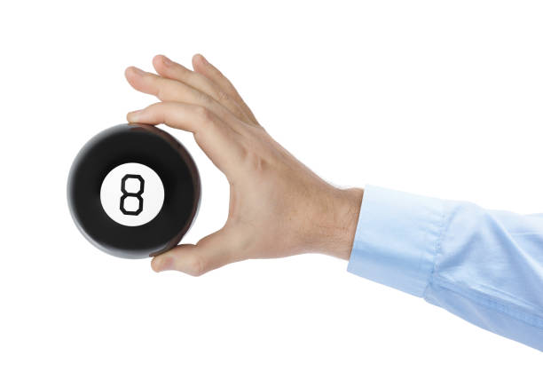 istock Hand with magic billiard ball number eight 1209076374
