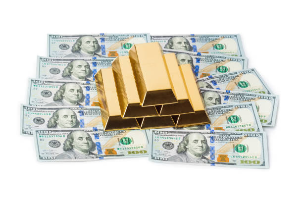 istock Gold bars and money 1209076691