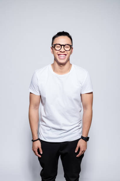istock Happy asian young man laughing at the camera 1209076817