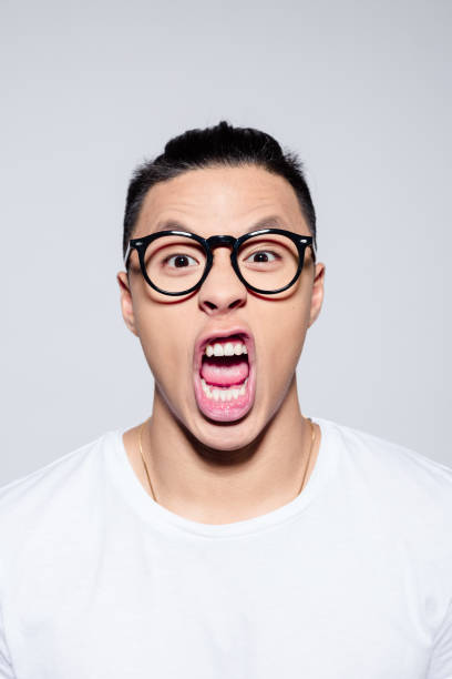 istock Portrait of angry asian young man 1209077213