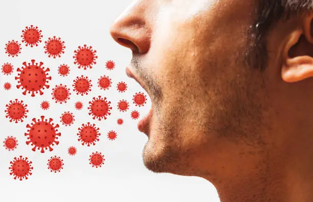 Virus coming out from mouth - Health Concept