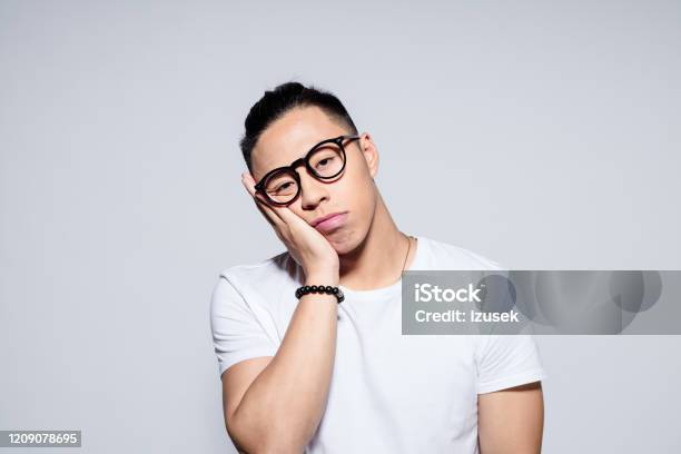 Worried Asian Young Man Stock Photo - Download Image Now - Men, Asian and Indian Ethnicities, Worried