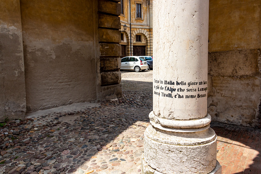 Mantua, Italy - May 28, 2018: Old column in a courtyard at Palazzo Ducale or the Ducal Palace in Mantova or Mantua, Lombardy, Italy