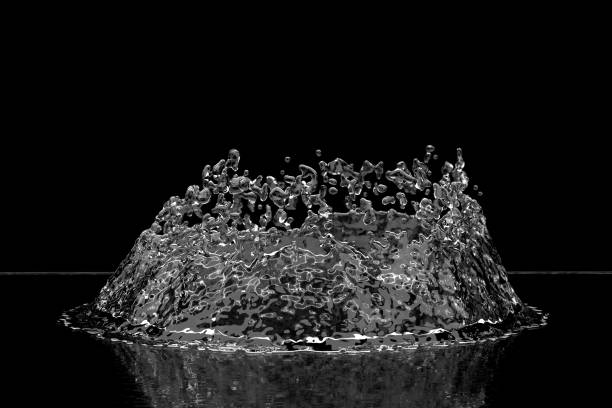 istock Corona splash of crystal clear water on isolated on black background. Selective focus macro shot with shallow DOF 1209079554