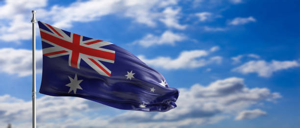 istock Australia national flag waving on blue sky background. 3d illustration 1209080307