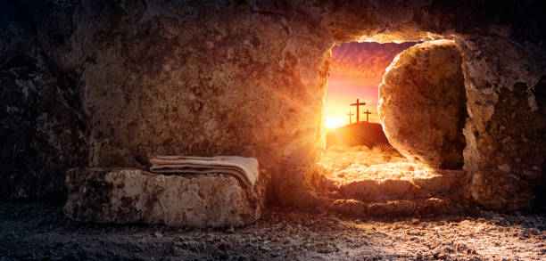Tomb Empty With Shroud And Crucifixion At Sunrise - Resurrection Of Jesus Christ Empty tomb of Jesus at sunrise with crosses in background tomb photos stock pictures, royalty-free photos & images