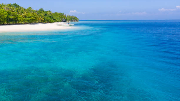 istock Turquoise lagoon and tropical island. 1209084771