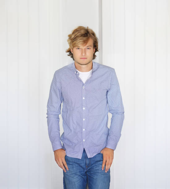 istock Teenager standing near a white wall 1209087065