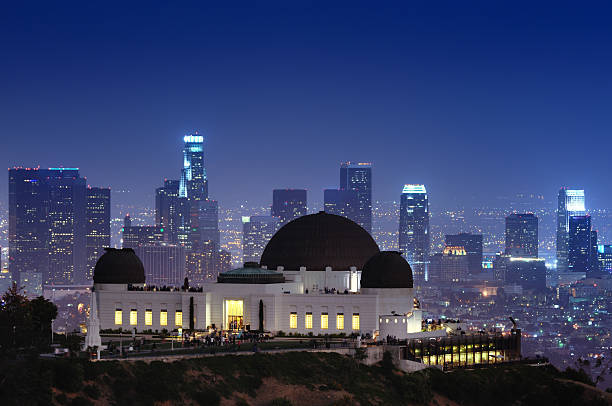 Griffith Observatory with a cityscape background Sitting on Mount Hollywood in Los Angeles, Griffith Observatory is one of the most visited landmarks in southern California, USA. griffith park observatory stock pictures, royalty-free photos & images