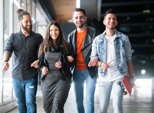 istock Four friends having fun in the city 1209088586