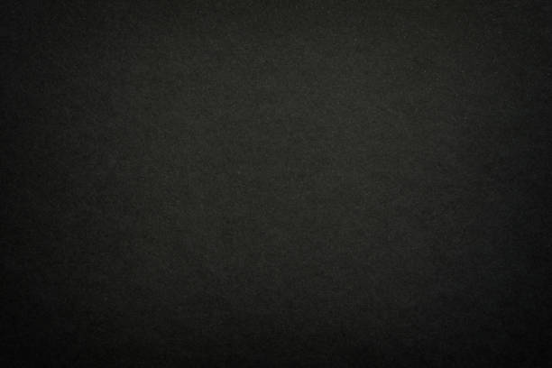 istock Black matte paper texture background. Surface of abstract dark texture. Gray blank page background flat close up view. 1209088865