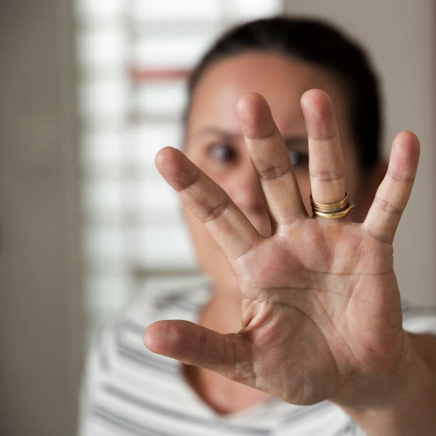 istock Woman's hand in front of her face 1209089859