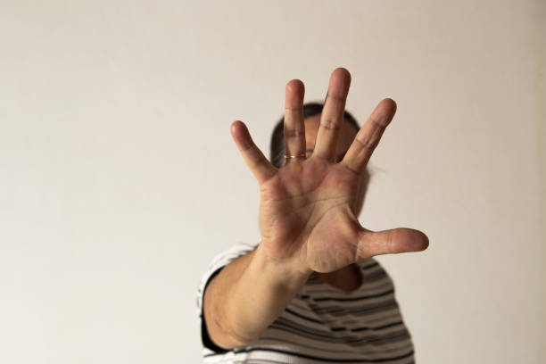 istock Woman's hand in front of her face 1209089863