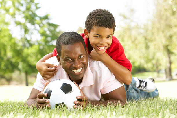 istock Father And Son Playing Football 120909013