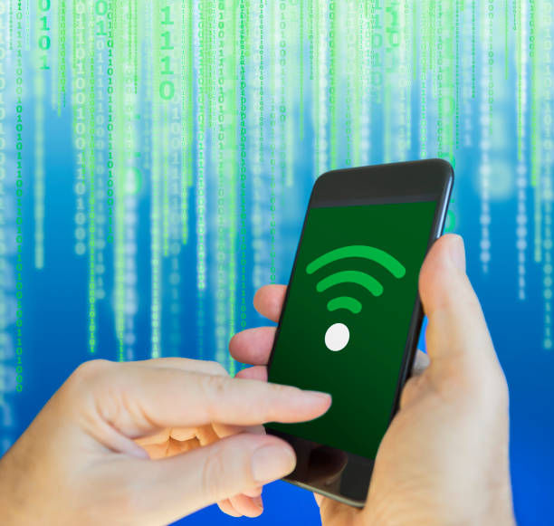 istock Hand holding cellphone with connection to WiFi 1209091443