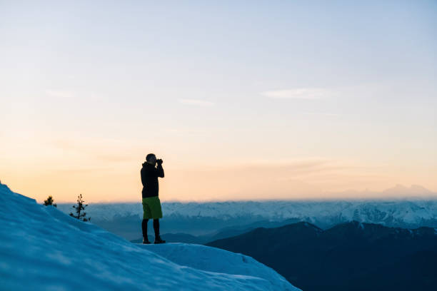 istock Trail runner takes a photo out over mountains at dawn 1209092306
