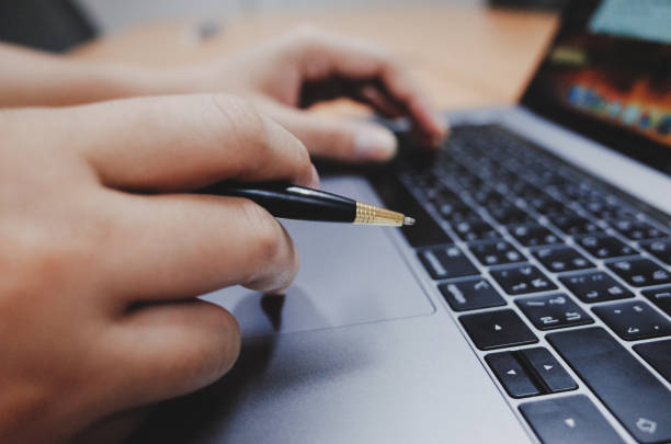 istock Business women signing a document after reading the agreement 1209092385