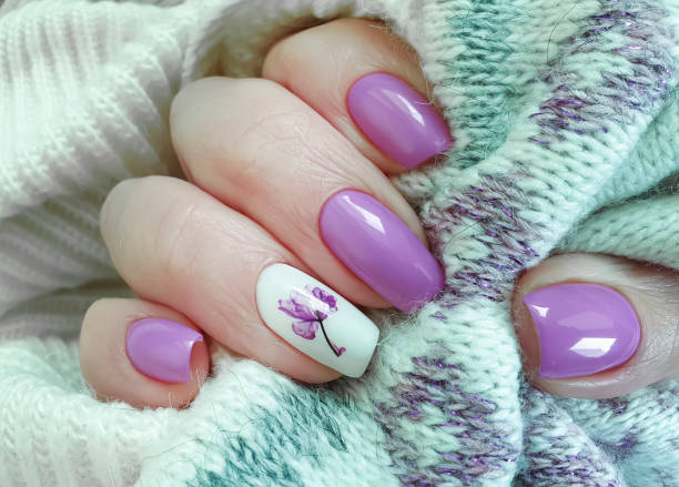 istock female hand nails beautiful manicure sweater 1209099135