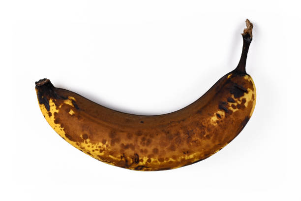 istock Old overripe brown banana fruit isolated on white background 1209099267
