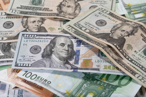istock Background made of dollar and euro banknotes 1209099328