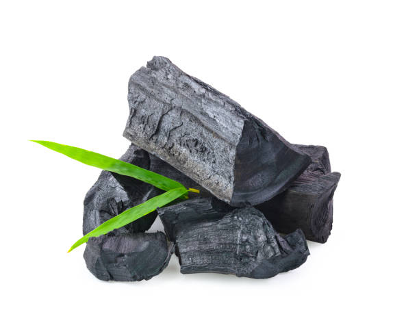 istock Natural wood charcoal on white background 1209104289