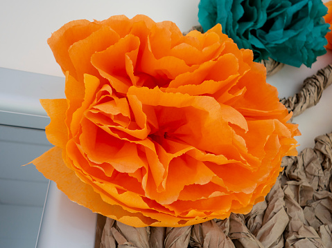 Paper Flower made by hand from orange paper