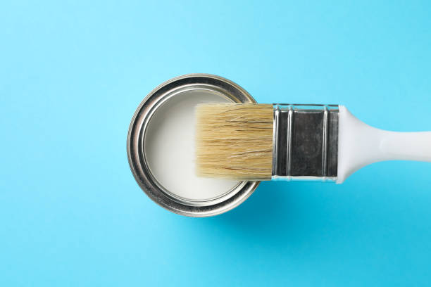 istock Paint can and brush on blue background, top view 1209105469